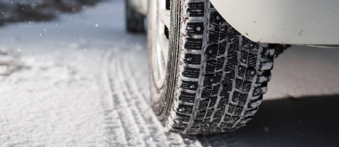 Closeup of car tires on snow