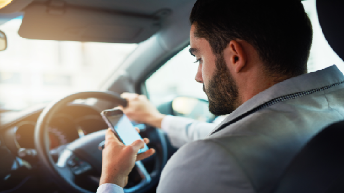 Man on phone to signify distracted driving