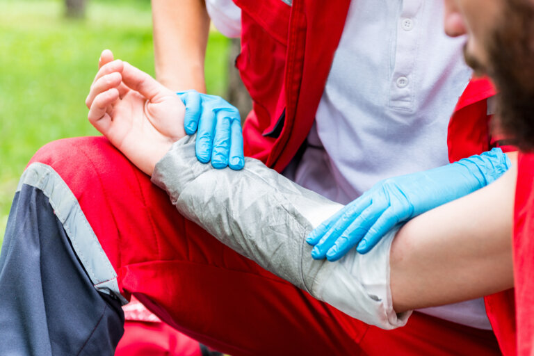 paramedic treating burn injury victim