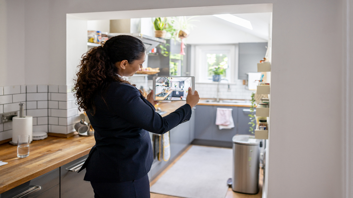 Real estate agent taking pictures of a home