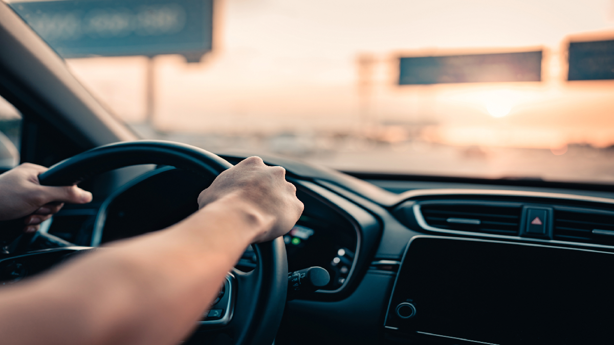 Person in car driving on highway