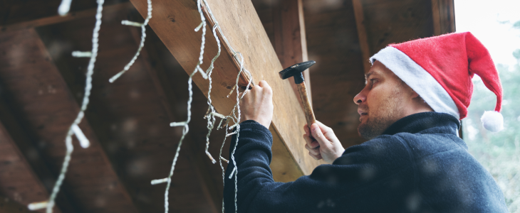 Man setting up holiday decorations