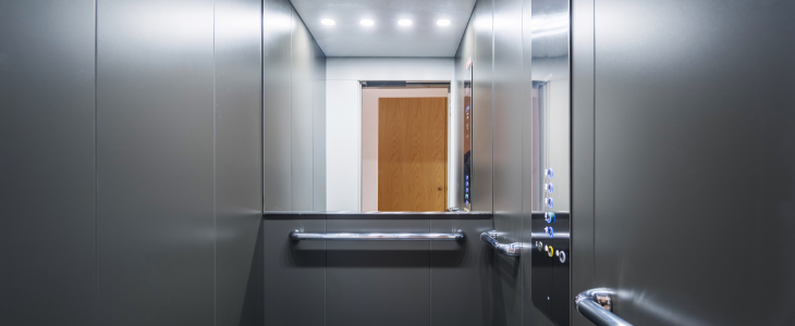 An empty elevator in a building to represent an elevator accident