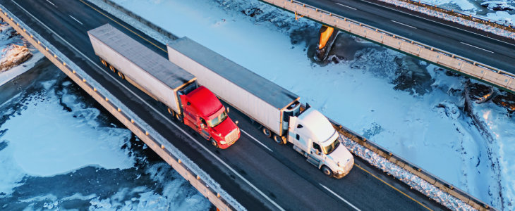 Trucks driving across a highway