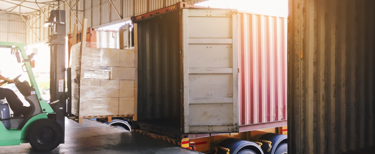 Truck being loaded by staff