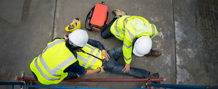 Construction worker laying on the floor after an accident
