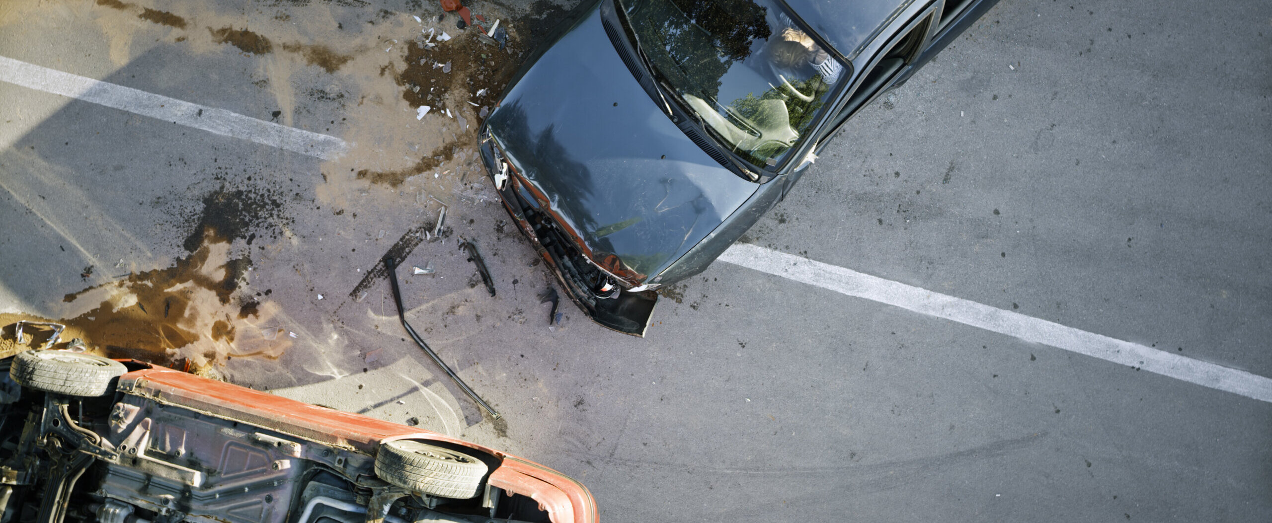 Elevated view of broken cars after accident.
