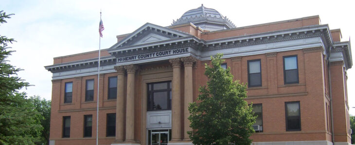 Brick courthouse building labeled “McHenry County Court House.”
