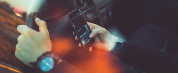 Man texting while driving