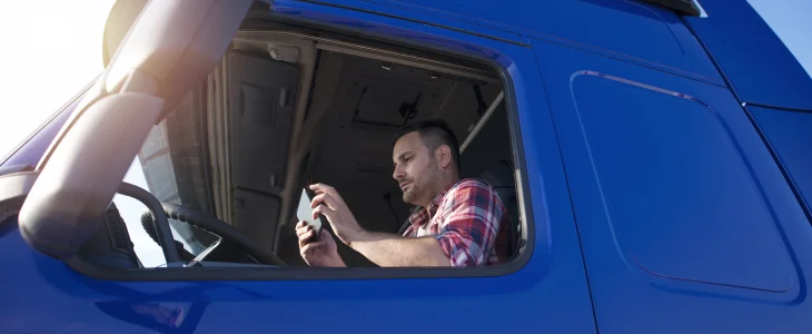 Truck driver distracted while working on the job